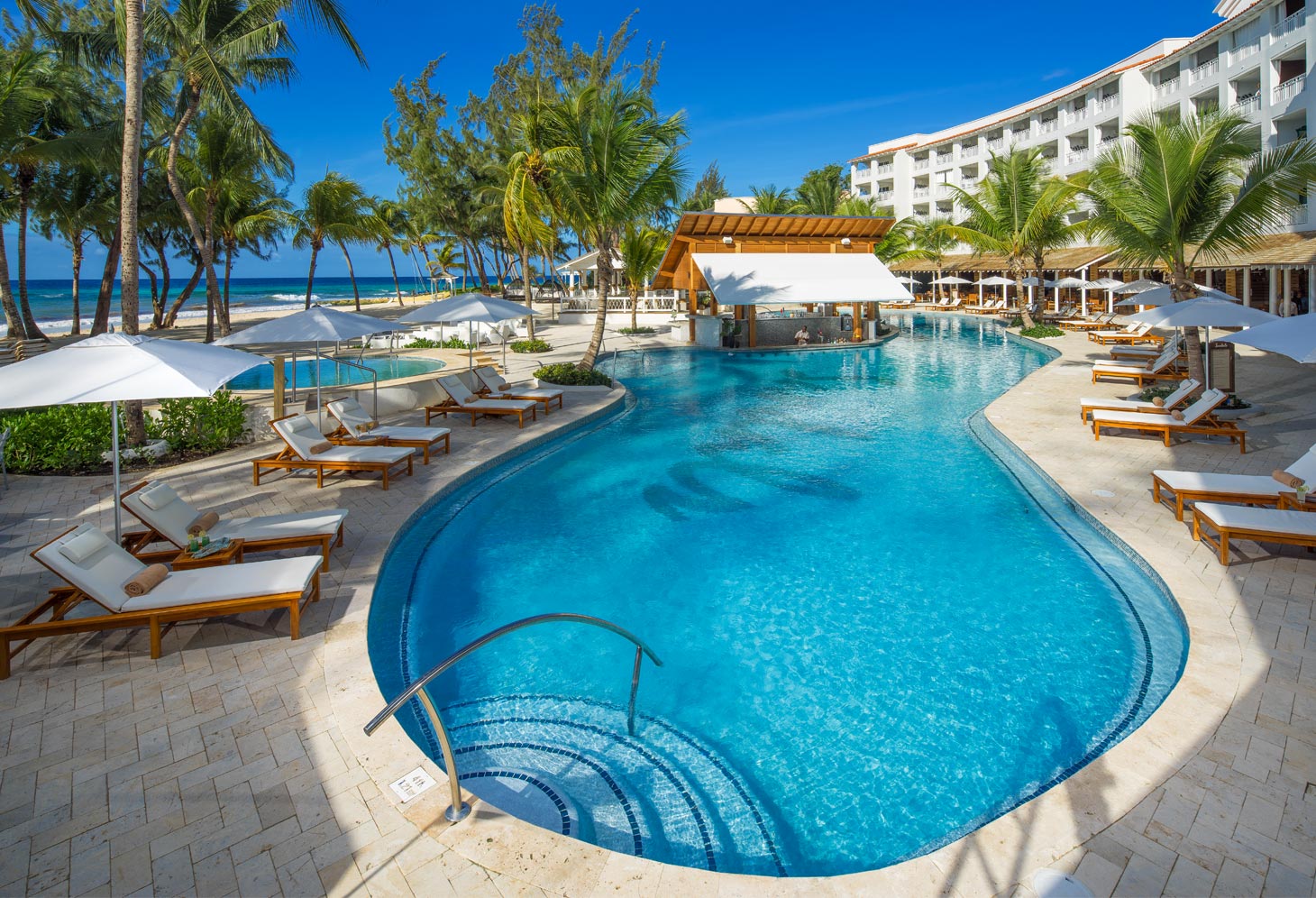 Sandals Barbados, an all-new all-inclusive in the spirited St. Lawrence Gap area, offers undeniable luxury with inventive accommodations spanning three unique villages, world-class cuisine with international appeal, including a festive Indian cuisine restaurant, and innovative bar and pool designs. Unwind to the relaxed calypso beat, enjoy the sun & surf and explore the sexiness of your suite, an abode designed with your utmost comfort in mind and featuring everything from ocean views, Butler Elite service and zero-entry access to Barbados